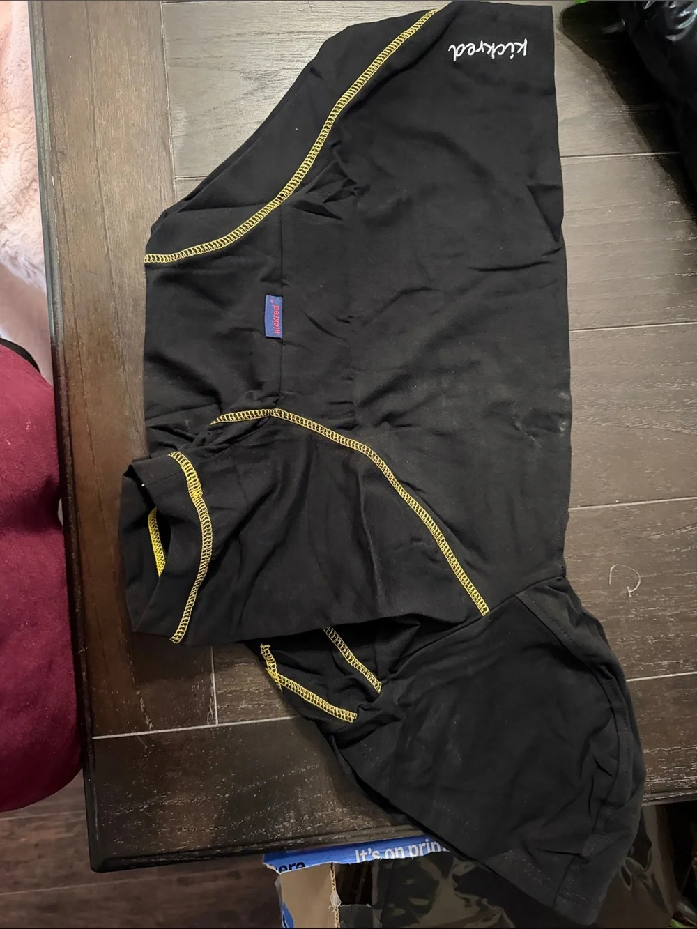 2 dog hooded t-shirts. On gray one black. Never used. Can fit 30 to 40 lbs dog